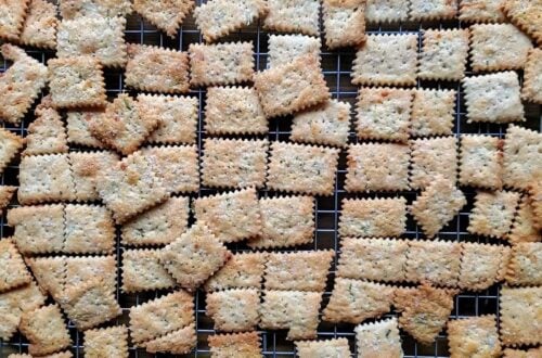 Sourdough crackers resting on a metal wire cooling rack.