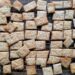 Sourdough crackers resting on a metal wire cooling rack.