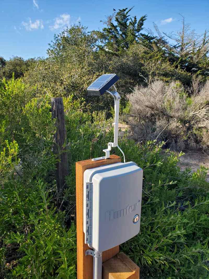 A Hunter irrigation controller box with solar panel attachment. 